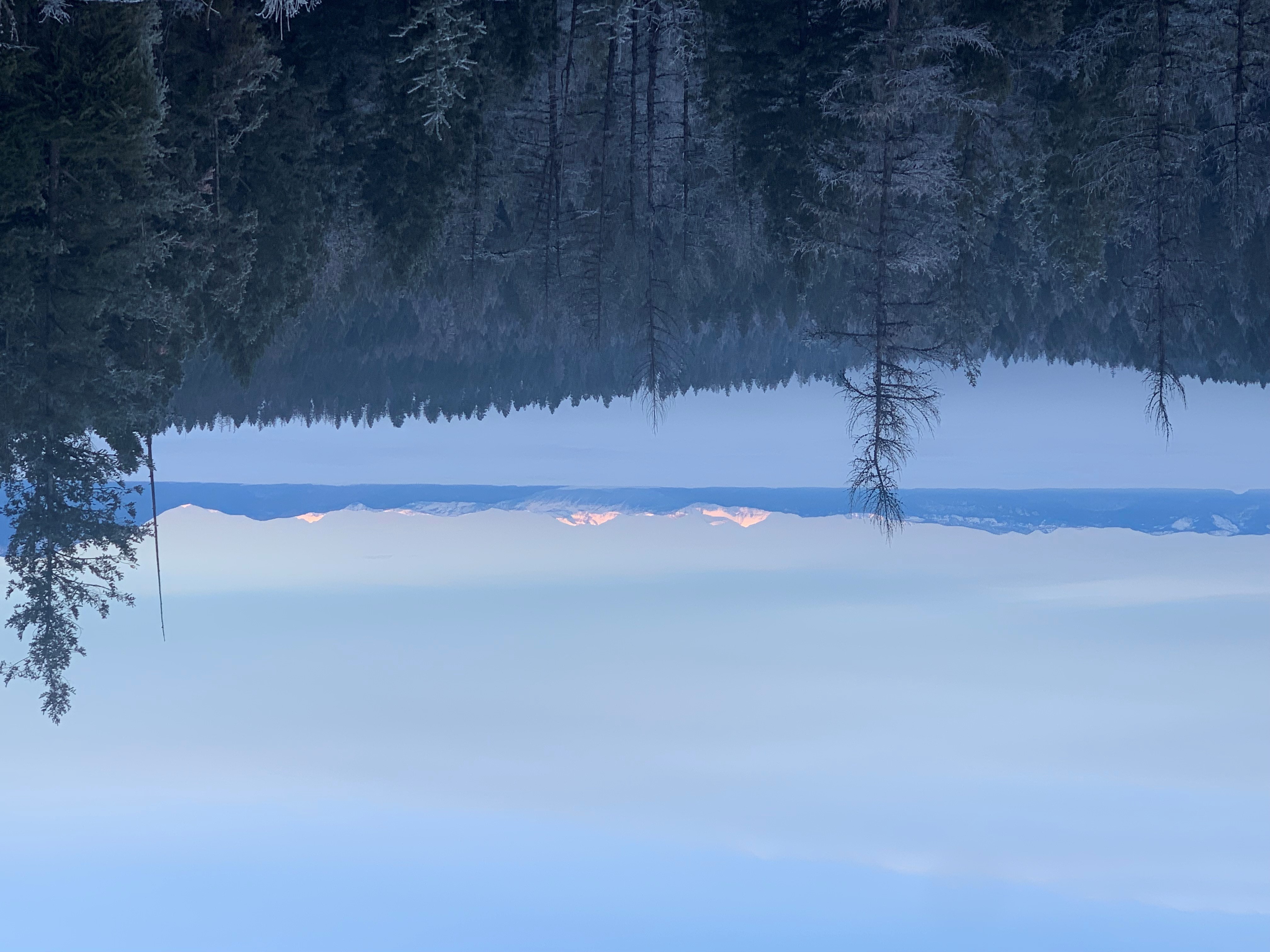 An inversion layer completely blankets the Flathead Valley with snowy peaks from Glacier National Park in the distance